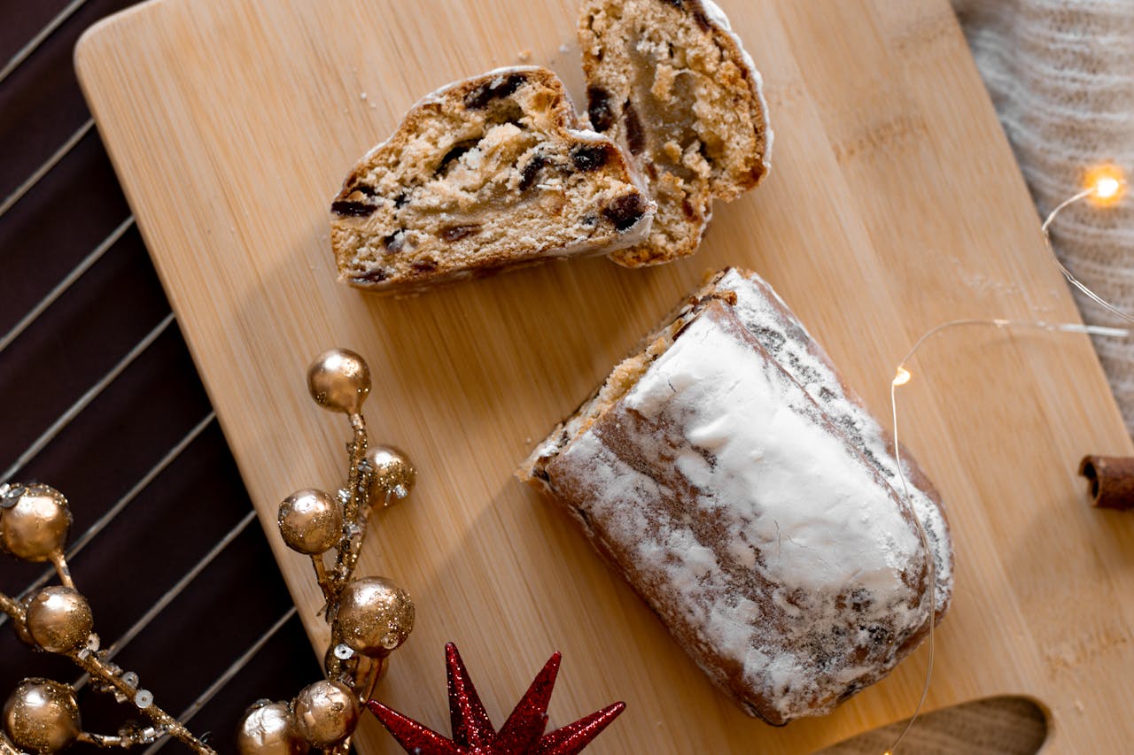 A delicious sliced stollen bread with dried fruits, perfect for festive occasions.